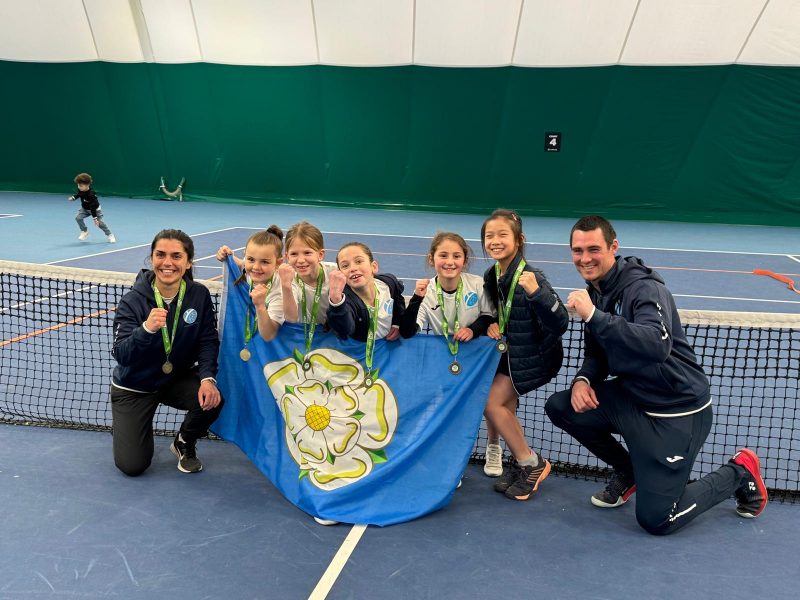 Tennis players with flag