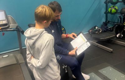 Man and boy looking at book